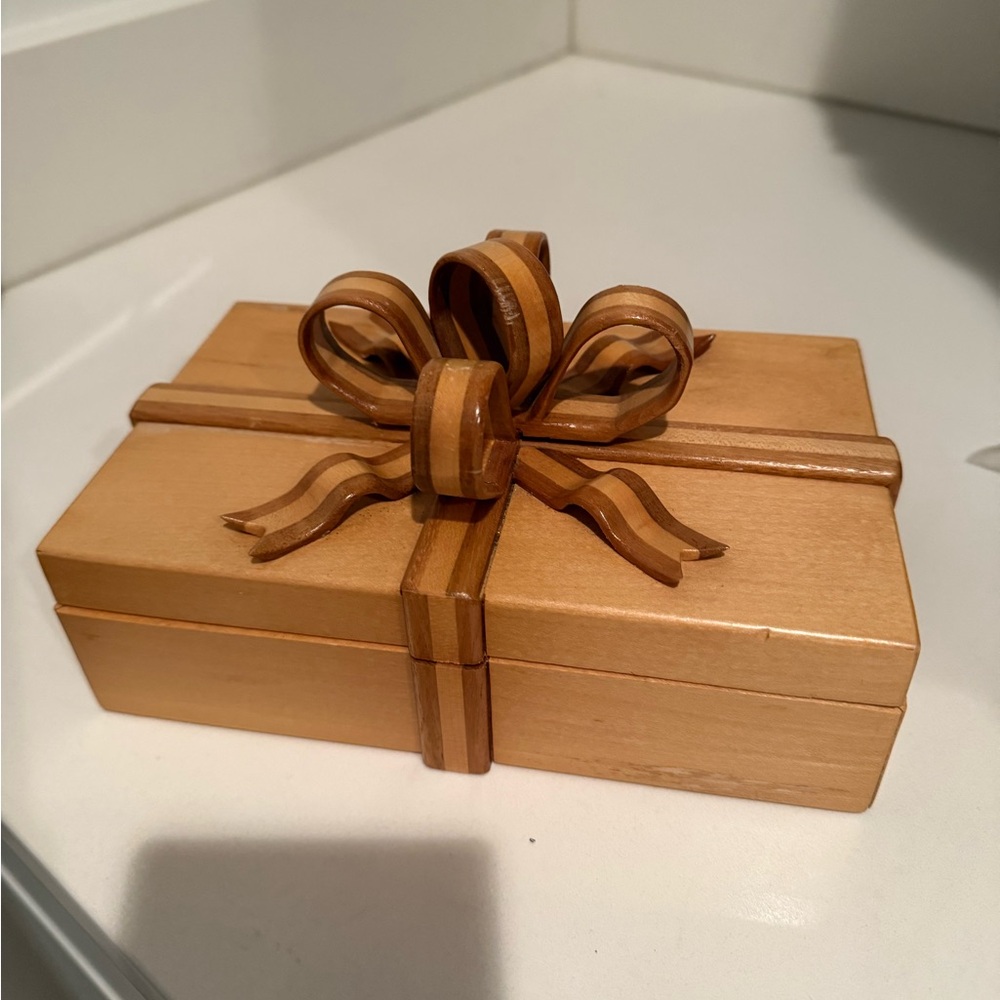 Handmade vintage wooden box with carved striped wooden ribbon